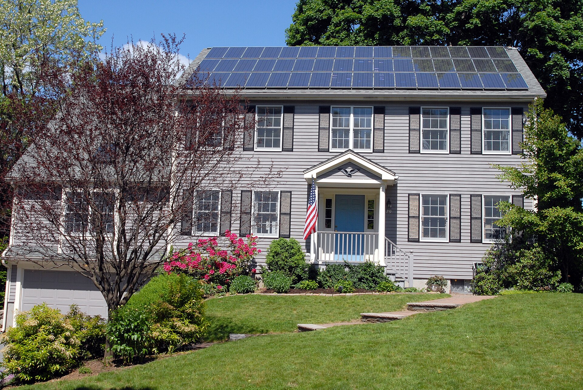 Home Battery Storage: Keeping Solar Power After Dark Solar panels fitted on the roof of a house